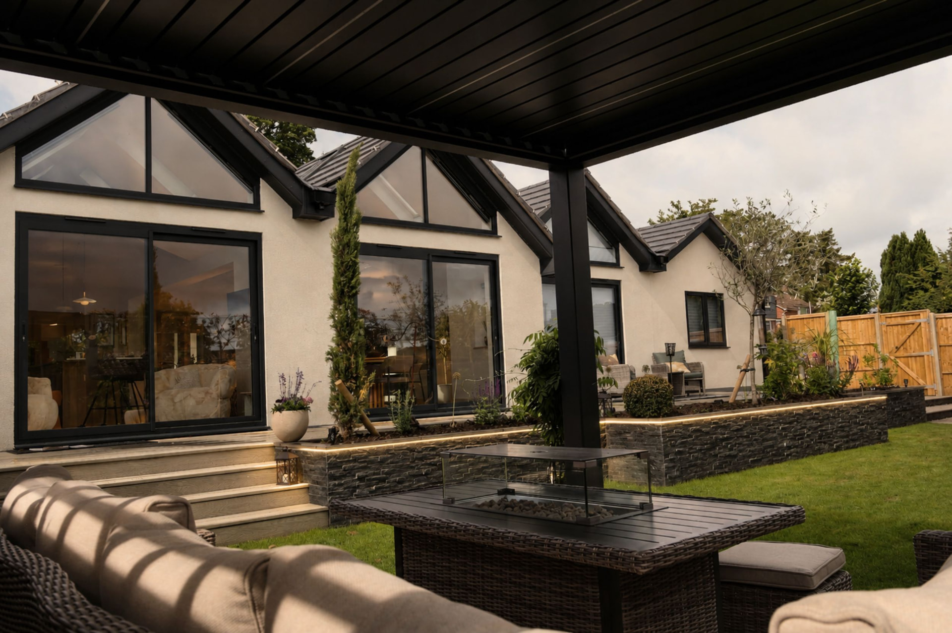 Louv Pro pergola seen across a Sussex garden